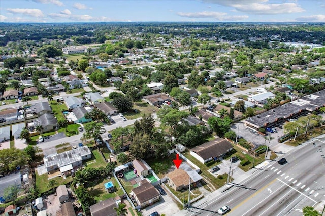 birds eye view of property with a residential view