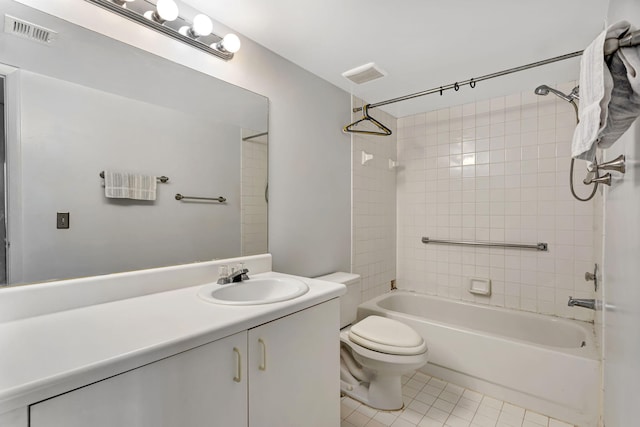 bathroom featuring toilet, tile patterned flooring, visible vents, and vanity