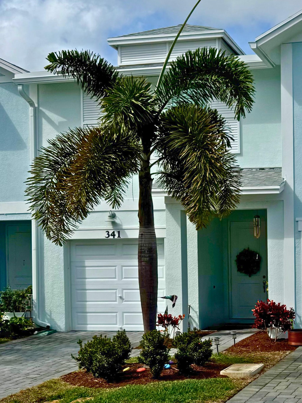 exterior space featuring a garage and stucco siding