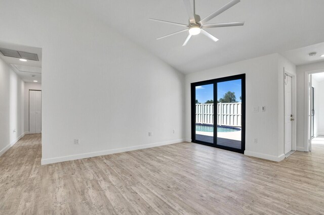 spare room with ceiling fan, visible vents, baseboards, and light wood-style flooring