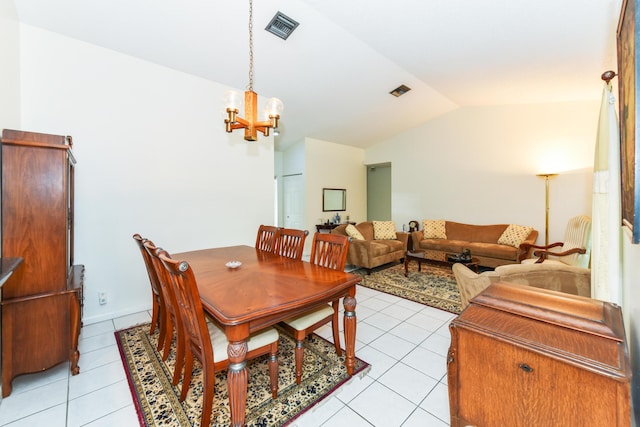 dining room featuring a chandelier, visible vents, vaulted ceiling, and light tile patterned flooring