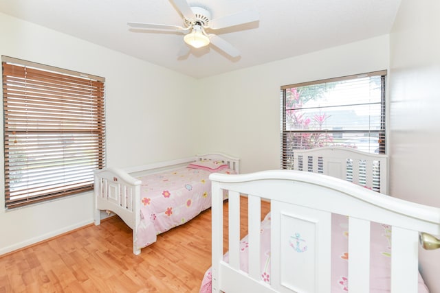 bedroom featuring ceiling fan and light wood-style flooring