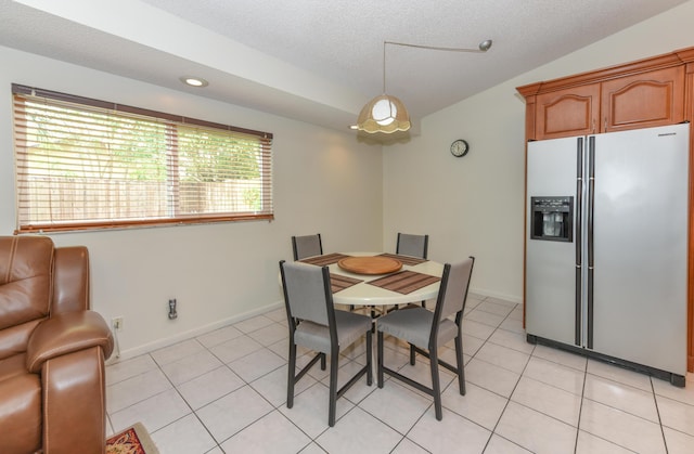 dining space featuring recessed lighting, light tile patterned flooring, vaulted ceiling, a textured ceiling, and baseboards