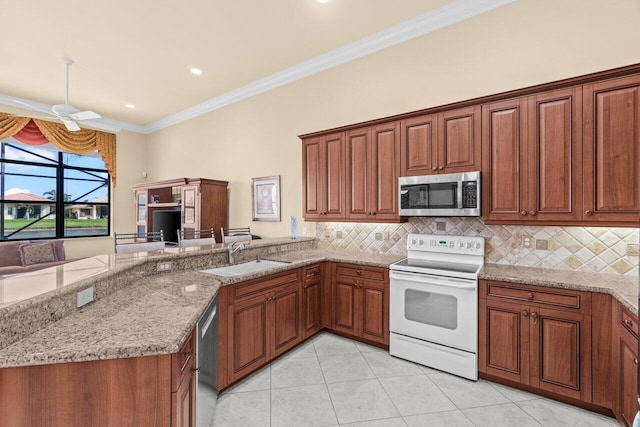 kitchen featuring appliances with stainless steel finishes, crown molding, a sink, and tasteful backsplash