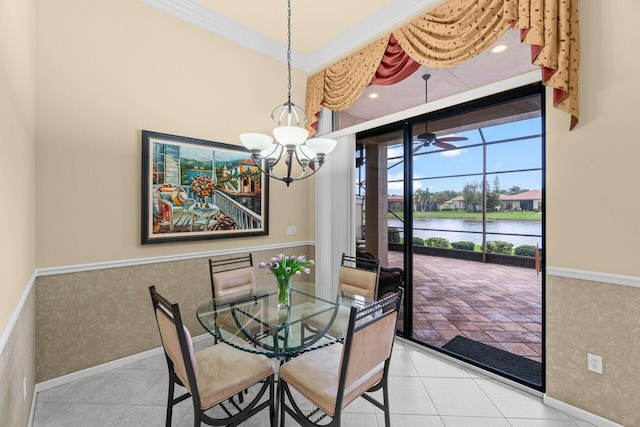 dining space featuring a notable chandelier, a water view, tile patterned floors, and crown molding