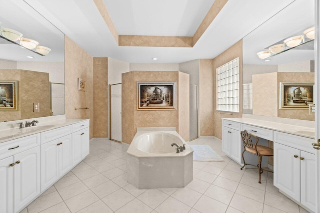 bathroom with tile patterned flooring, a raised ceiling, a sink, and wallpapered walls