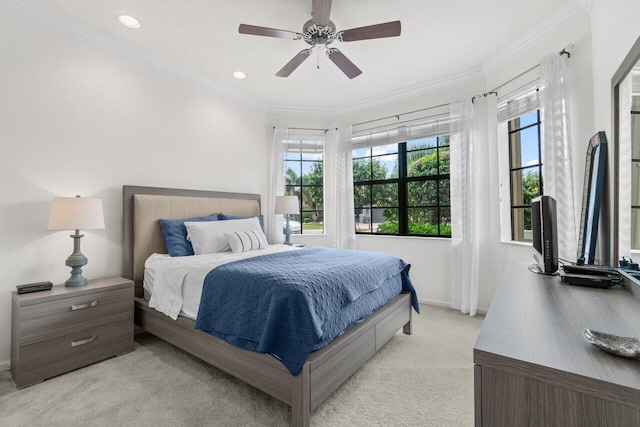 bedroom featuring light colored carpet, multiple windows, crown molding, and baseboards