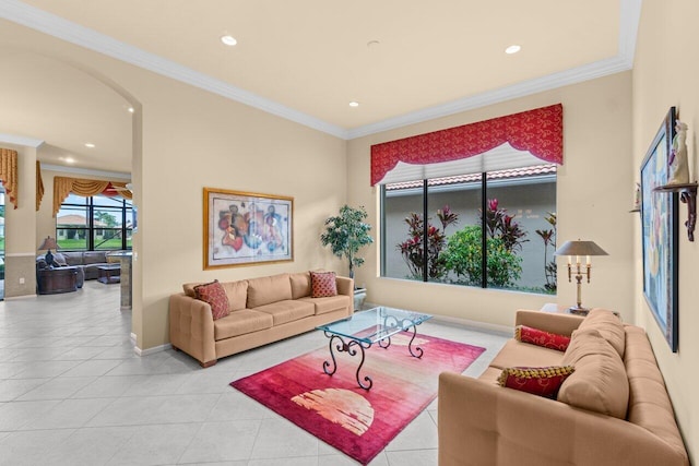 living room featuring arched walkways, recessed lighting, tile patterned flooring, and crown molding