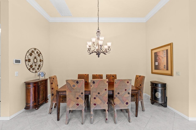 dining space featuring a chandelier, crown molding, baseboards, and light tile patterned floors