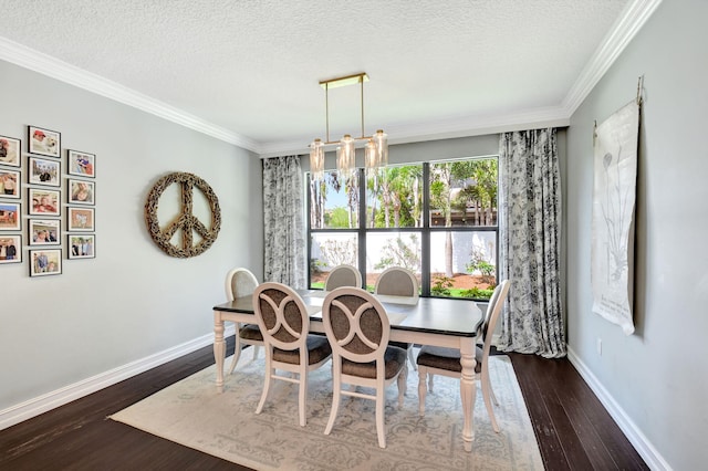 dining space with ornamental molding, dark wood-style flooring, a textured ceiling, and baseboards