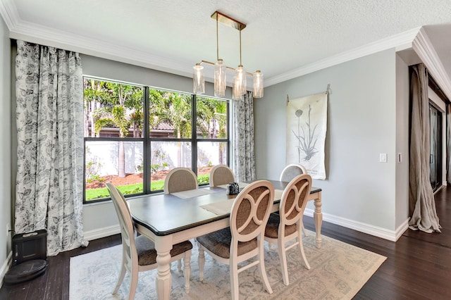 dining area featuring ornamental molding, dark wood-type flooring, a textured ceiling, and baseboards