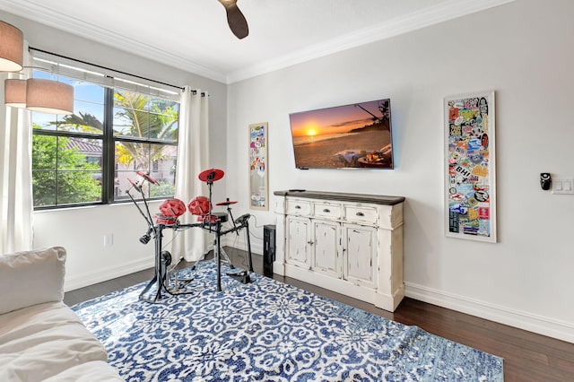 playroom featuring ceiling fan, ornamental molding, wood finished floors, and baseboards