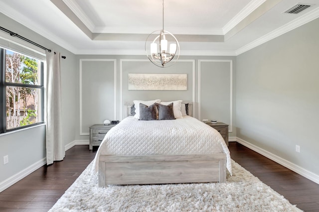 bedroom featuring dark wood-style flooring, a raised ceiling, visible vents, and an inviting chandelier