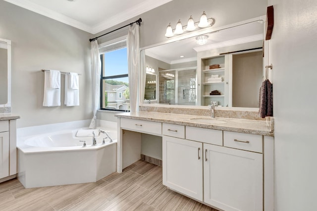 full bath featuring a stall shower, crown molding, vanity, and a bath