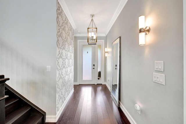 entrance foyer with dark wood-style floors, ornamental molding, stairway, and baseboards