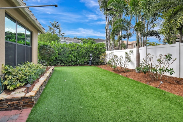 view of yard featuring a fenced backyard