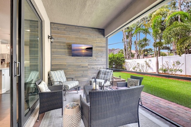 view of patio featuring fence and outdoor lounge area