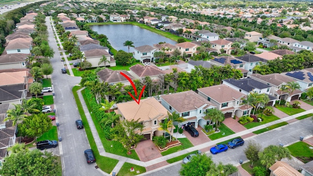 bird's eye view with a residential view and a water view