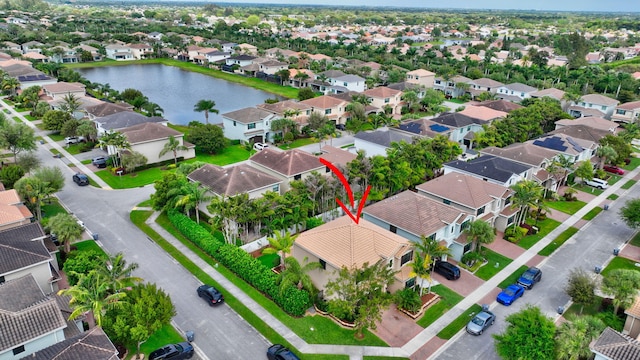 aerial view featuring a water view and a residential view