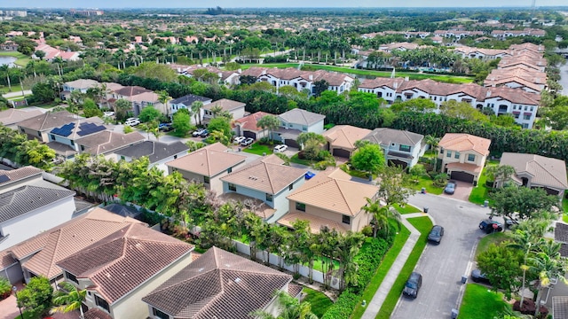 birds eye view of property with a residential view