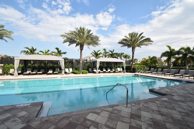 community pool featuring a patio and a gazebo