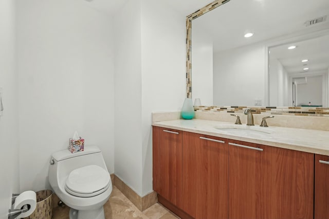 half bath featuring visible vents, toilet, tasteful backsplash, baseboards, and vanity