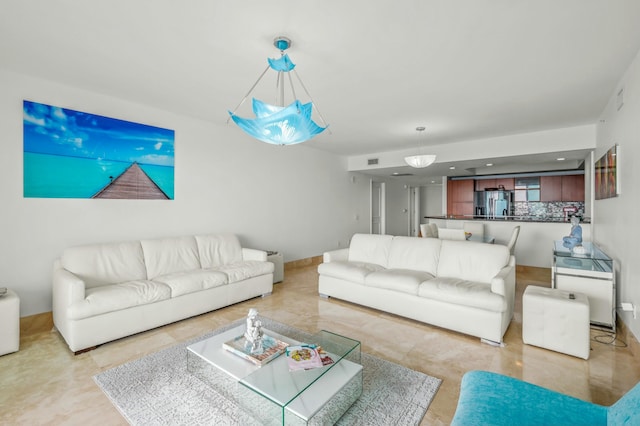 living area with visible vents and recessed lighting