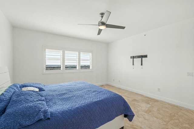 bedroom featuring ceiling fan, baseboards, and carpet floors