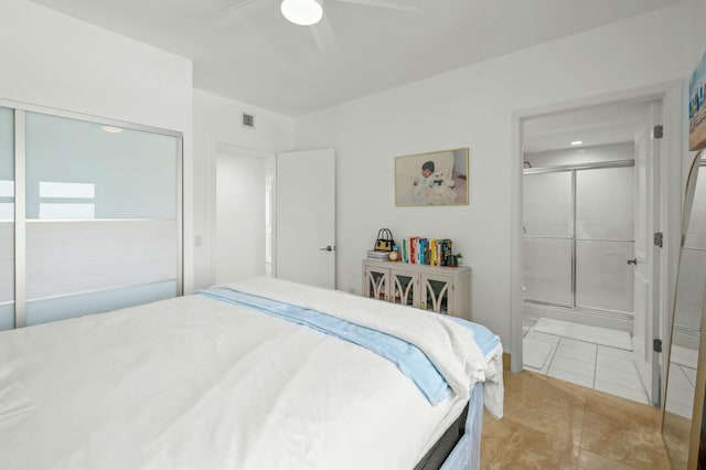 bedroom with visible vents, ensuite bath, and a ceiling fan