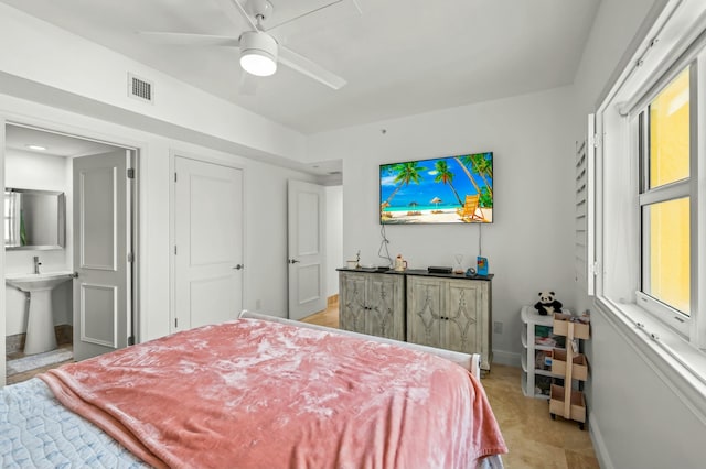 bedroom featuring multiple windows, baseboards, visible vents, and ceiling fan