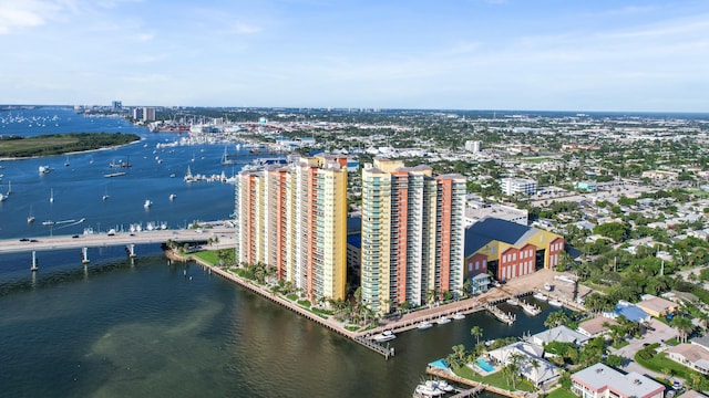 birds eye view of property featuring a view of city and a water view