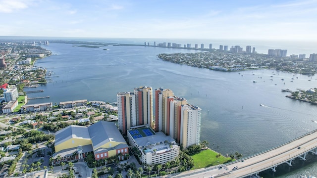 aerial view featuring a city view and a water view