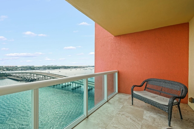 balcony with a view of city and a water view