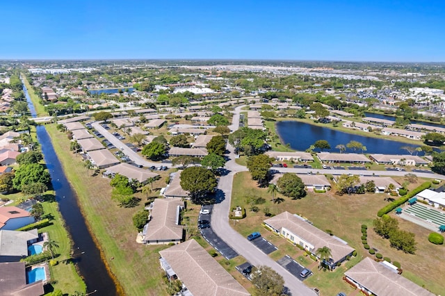 aerial view with a residential view and a water view