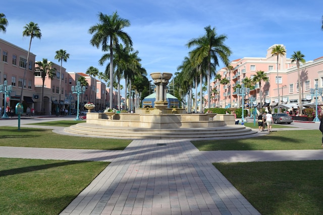 view of property's community with a lawn