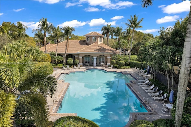 pool featuring a patio and fence