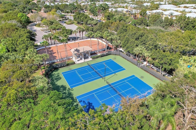 view of tennis court featuring fence