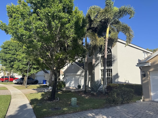 view of side of home with stucco siding