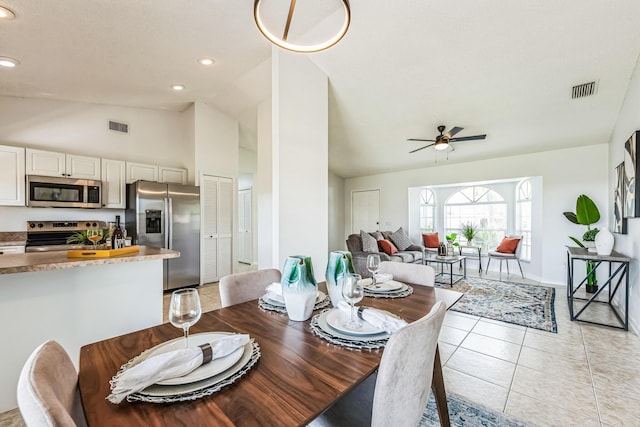 dining space featuring light tile patterned floors, lofted ceiling, visible vents, and recessed lighting