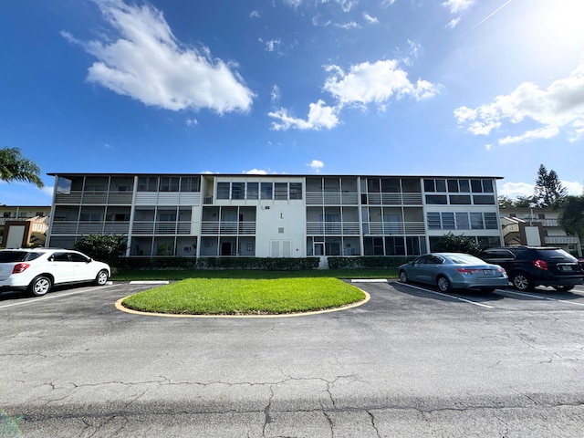 view of property with uncovered parking