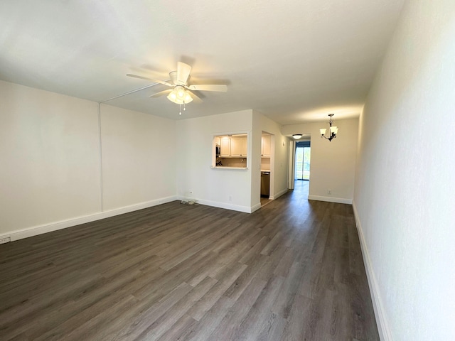 unfurnished living room featuring baseboards, dark wood-type flooring, and ceiling fan with notable chandelier