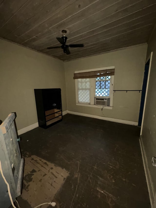 unfurnished bedroom with cooling unit, ceiling fan, and baseboards