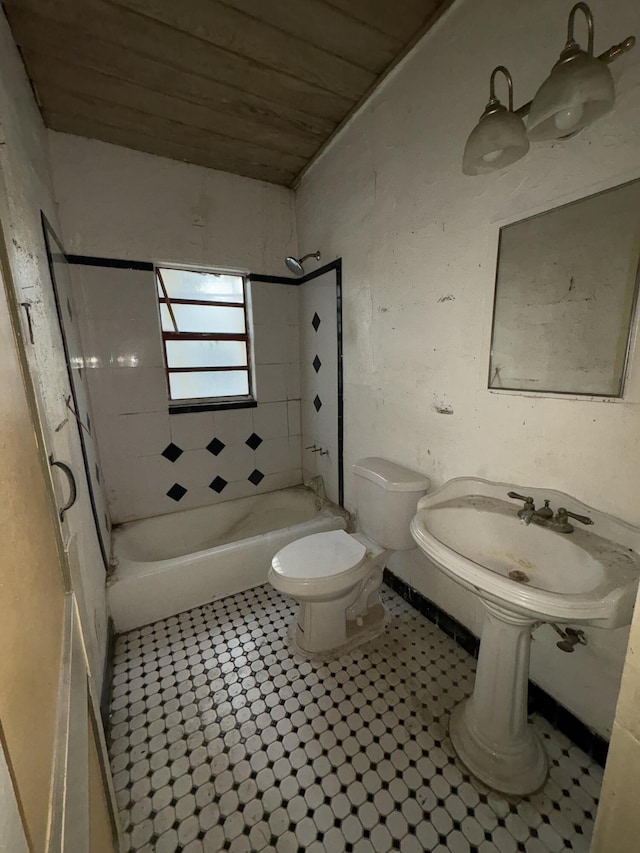 bathroom featuring  shower combination, tile patterned flooring, wooden ceiling, and toilet