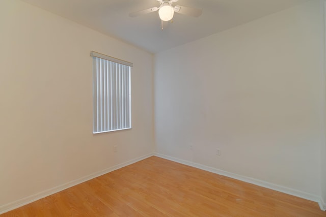 unfurnished room featuring baseboards, ceiling fan, and light wood finished floors