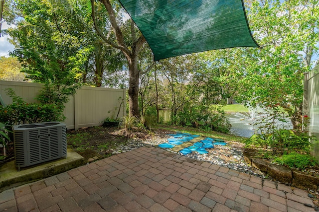 view of patio / terrace featuring a fenced backyard and cooling unit