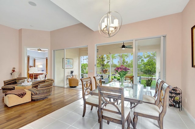 dining room with an inviting chandelier and light tile patterned floors