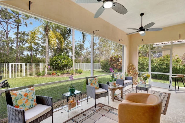 sunroom / solarium featuring ceiling fan