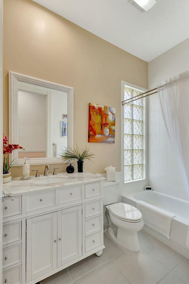 bathroom with vanity, washtub / shower combination, visible vents, tile patterned flooring, and toilet