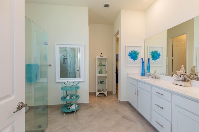 bathroom with tile patterned flooring, visible vents, vanity, and an enclosed shower