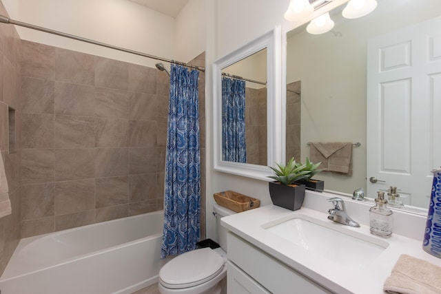 bathroom with toilet, shower / tub combo with curtain, and vanity